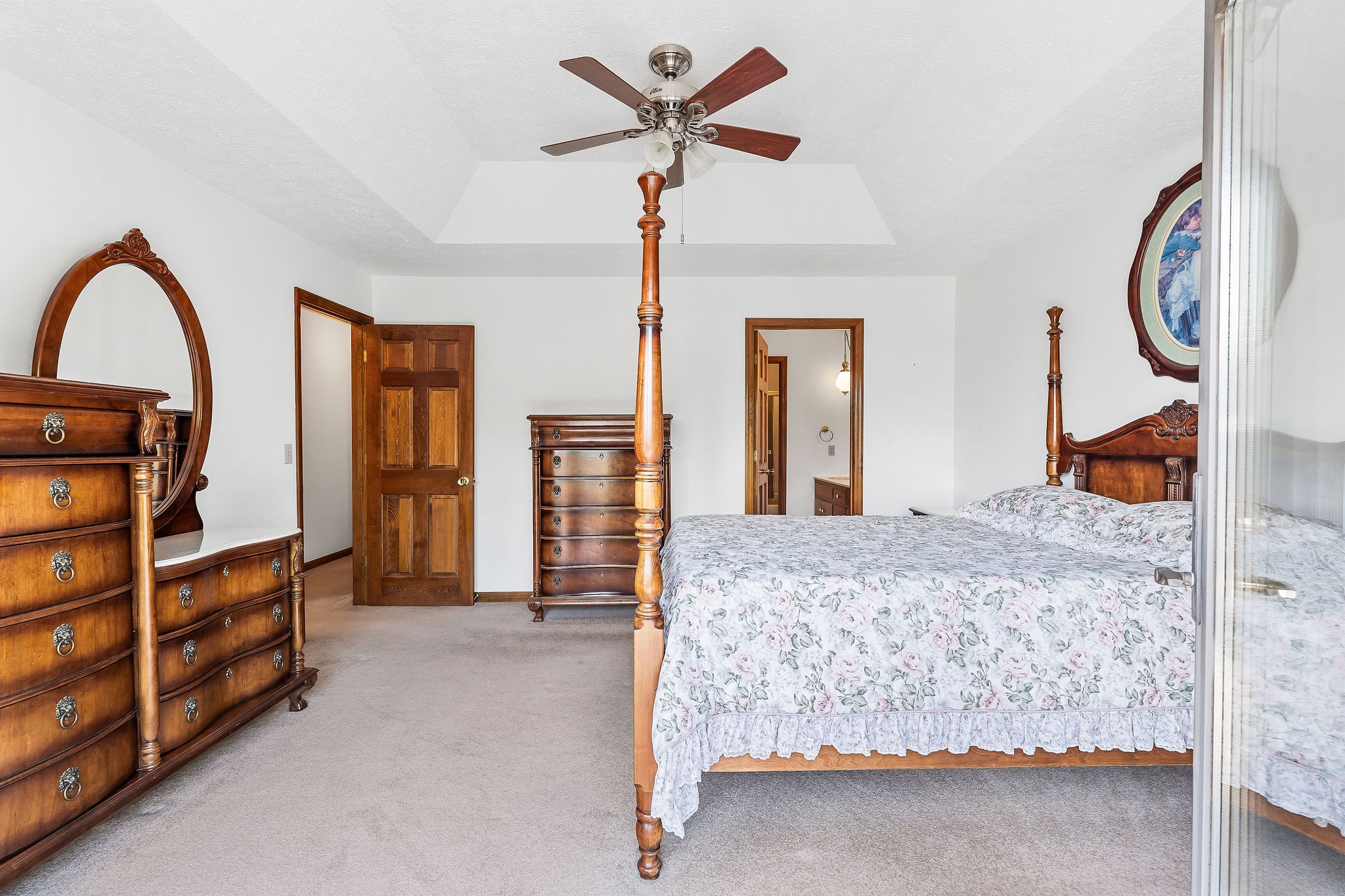 309 Cedar Hill Road Celina, TN 38551 - Photo 35 of 60 a bedroom with a bed and dresser with mirror