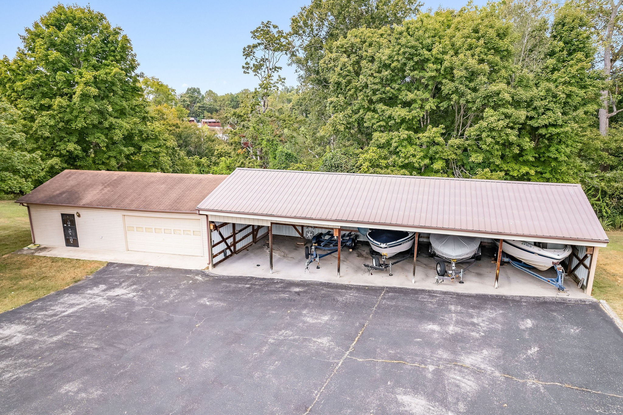 309 Cedar Hill Road Celina, TN 38551 - Photo 4 of 60 a view of a patio with a table and chairs under an umbrella