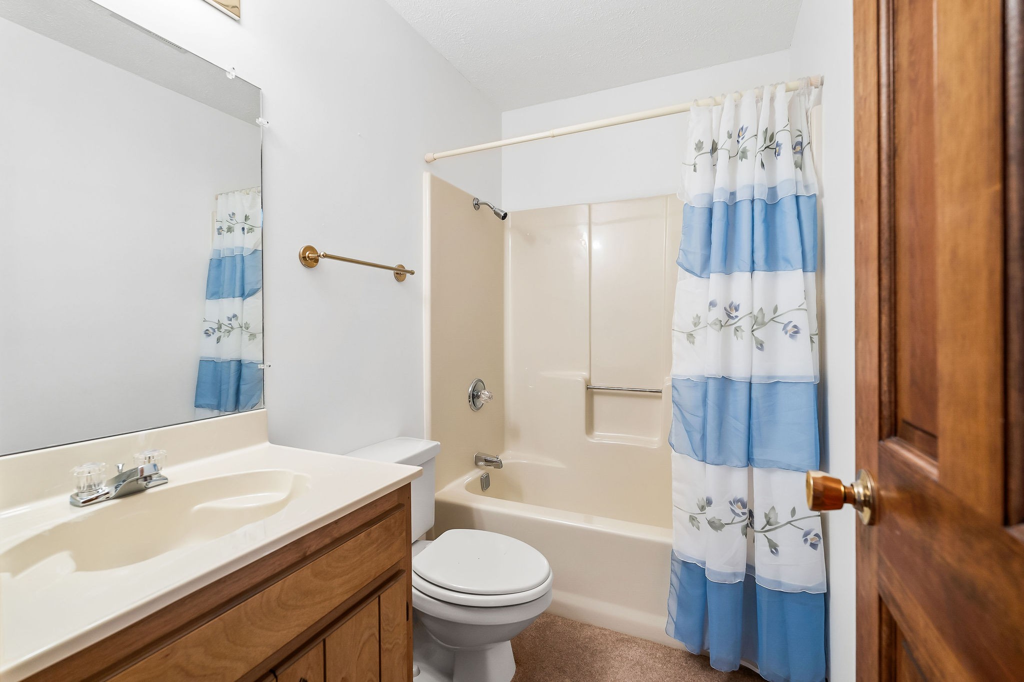 309 Cedar Hill Road Celina, TN 38551 - Photo 41 of 60 a bathroom with a sink a toilet and shower curtain