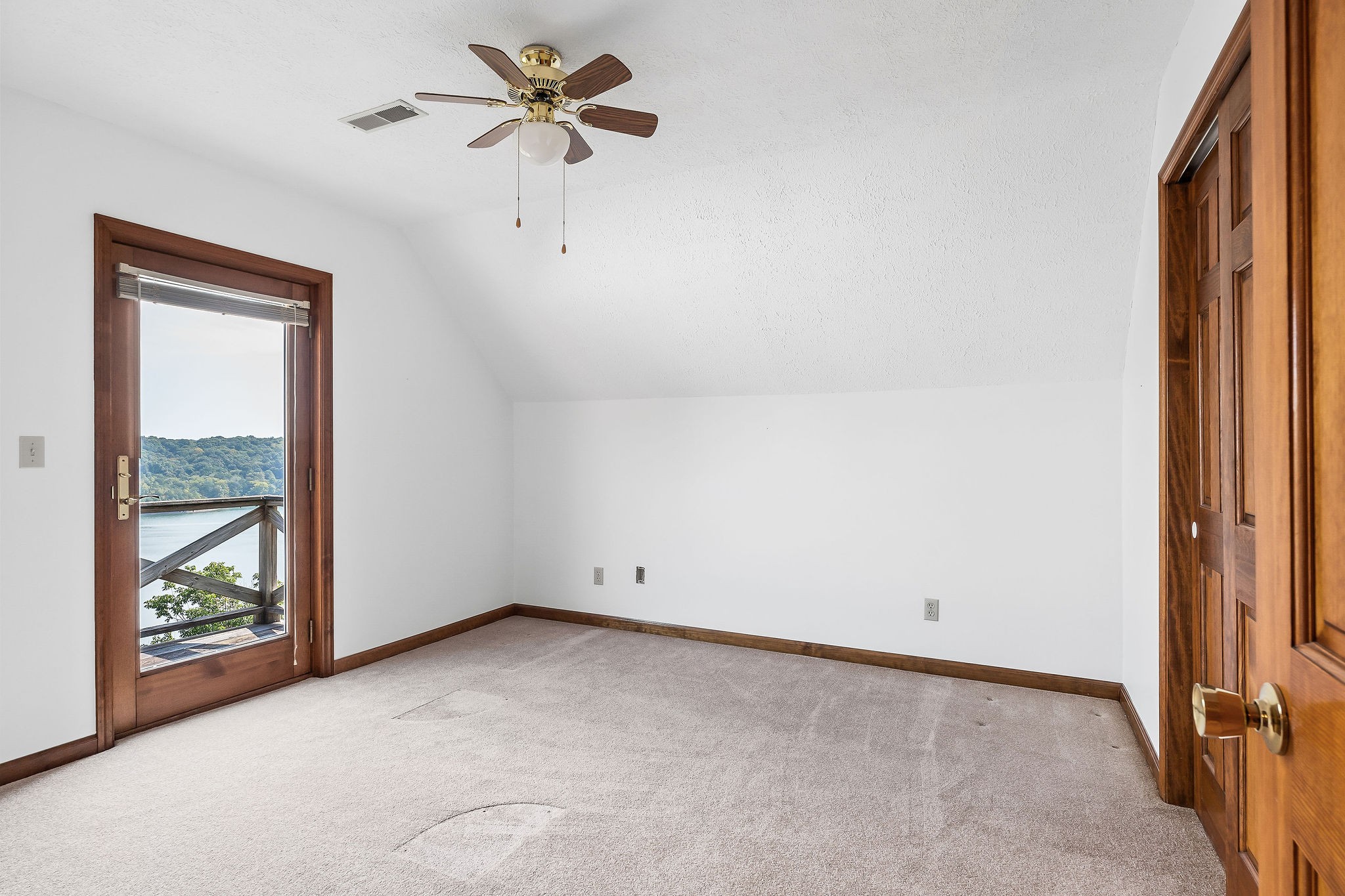 309 Cedar Hill Road Celina, TN 38551 - Photo 42 of 60 an empty room with windows and closet