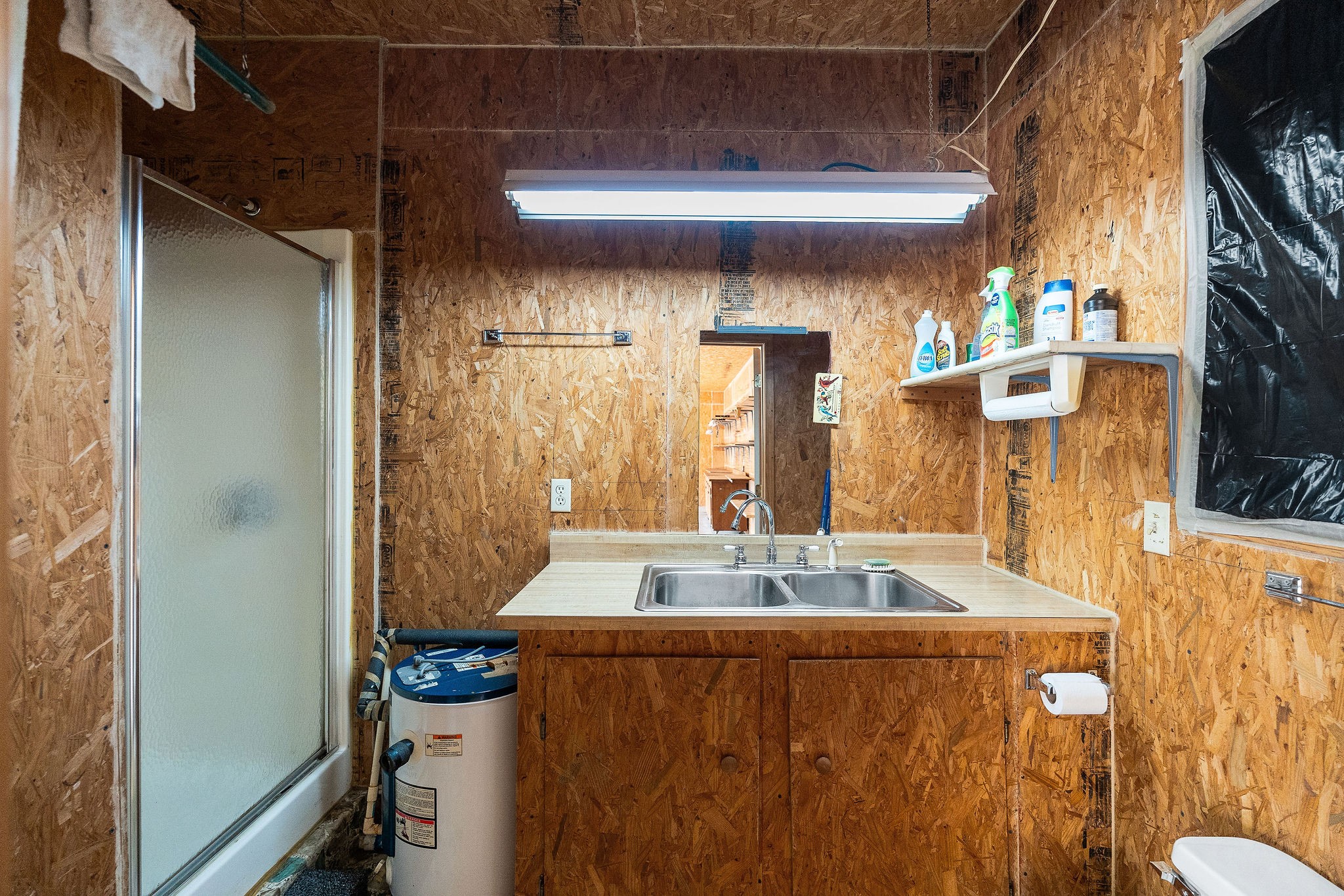 309 Cedar Hill Road Celina, TN 38551 - Photo 48 of 60 a bathroom with a sink and a mirror