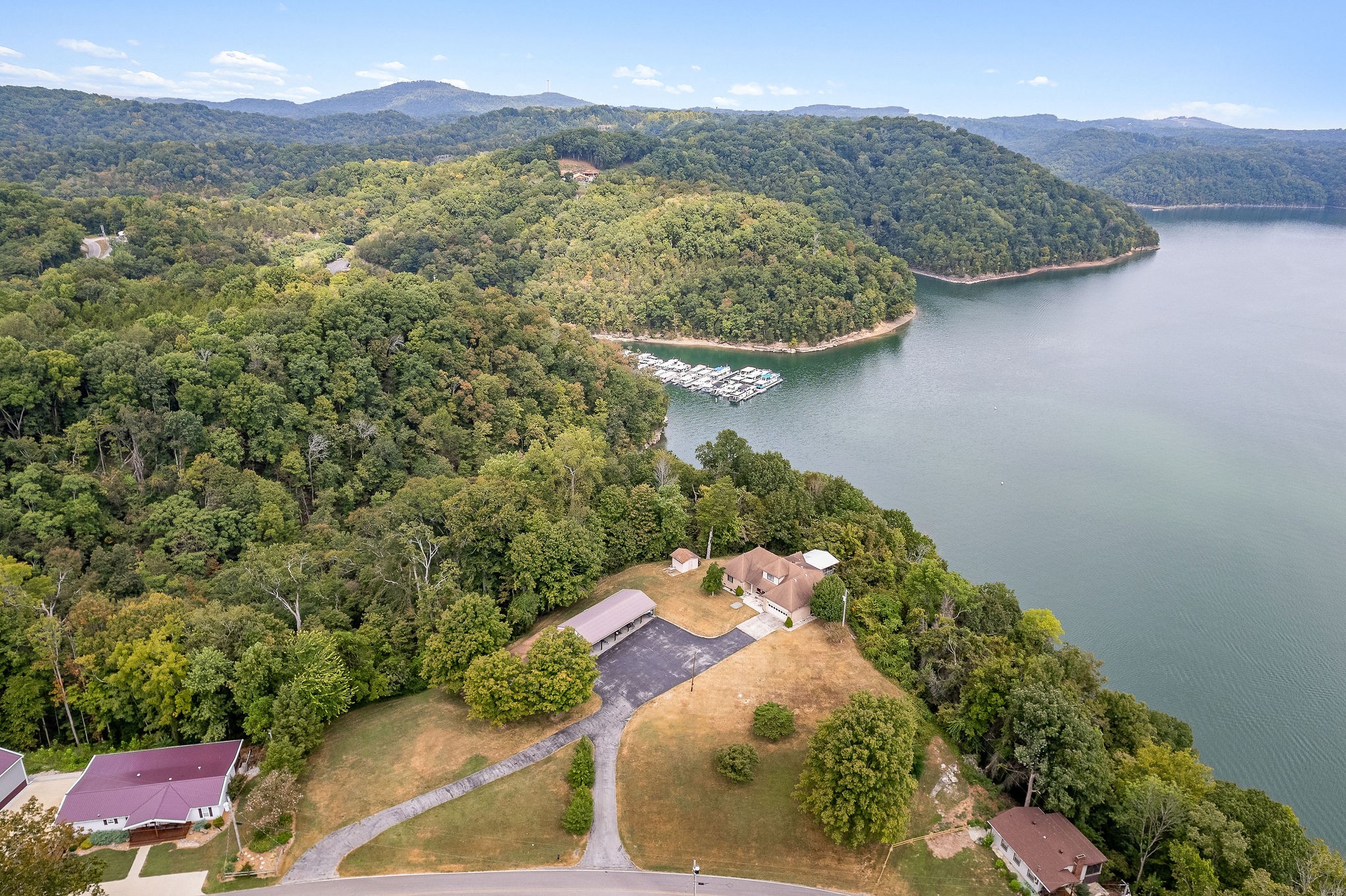 309 Cedar Hill Road Celina, TN 38551 - Photo 49 of 60 a view of a wooden house with a yard and outdoor seating