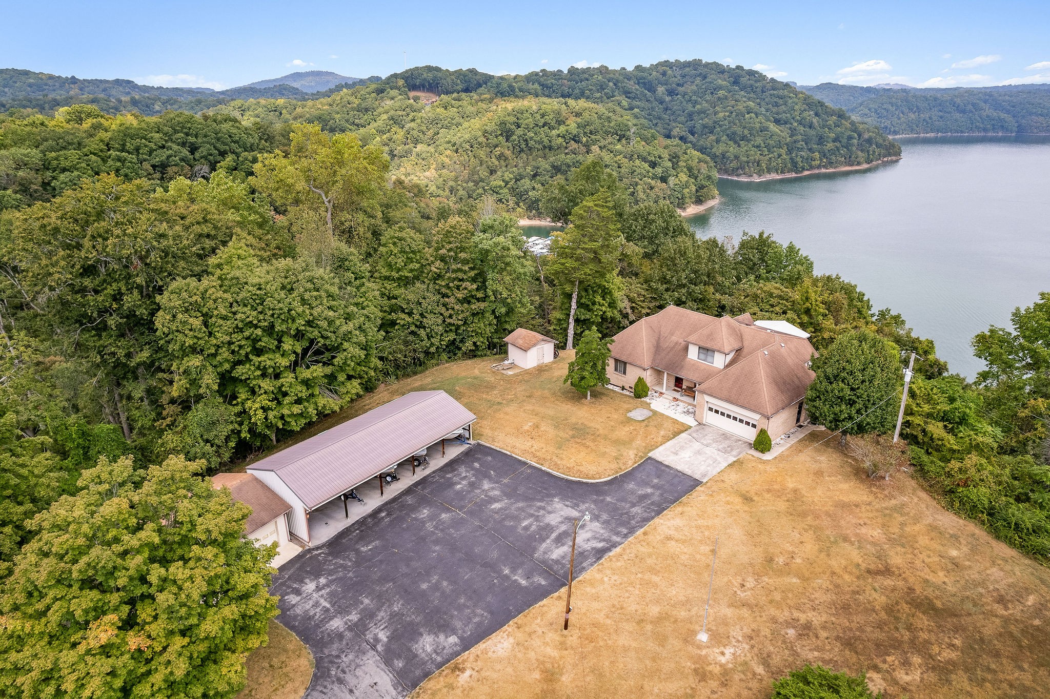 309 Cedar Hill Road Celina, TN 38551 - Photo 5 of 60 a view of a house with a yard and a mountain view