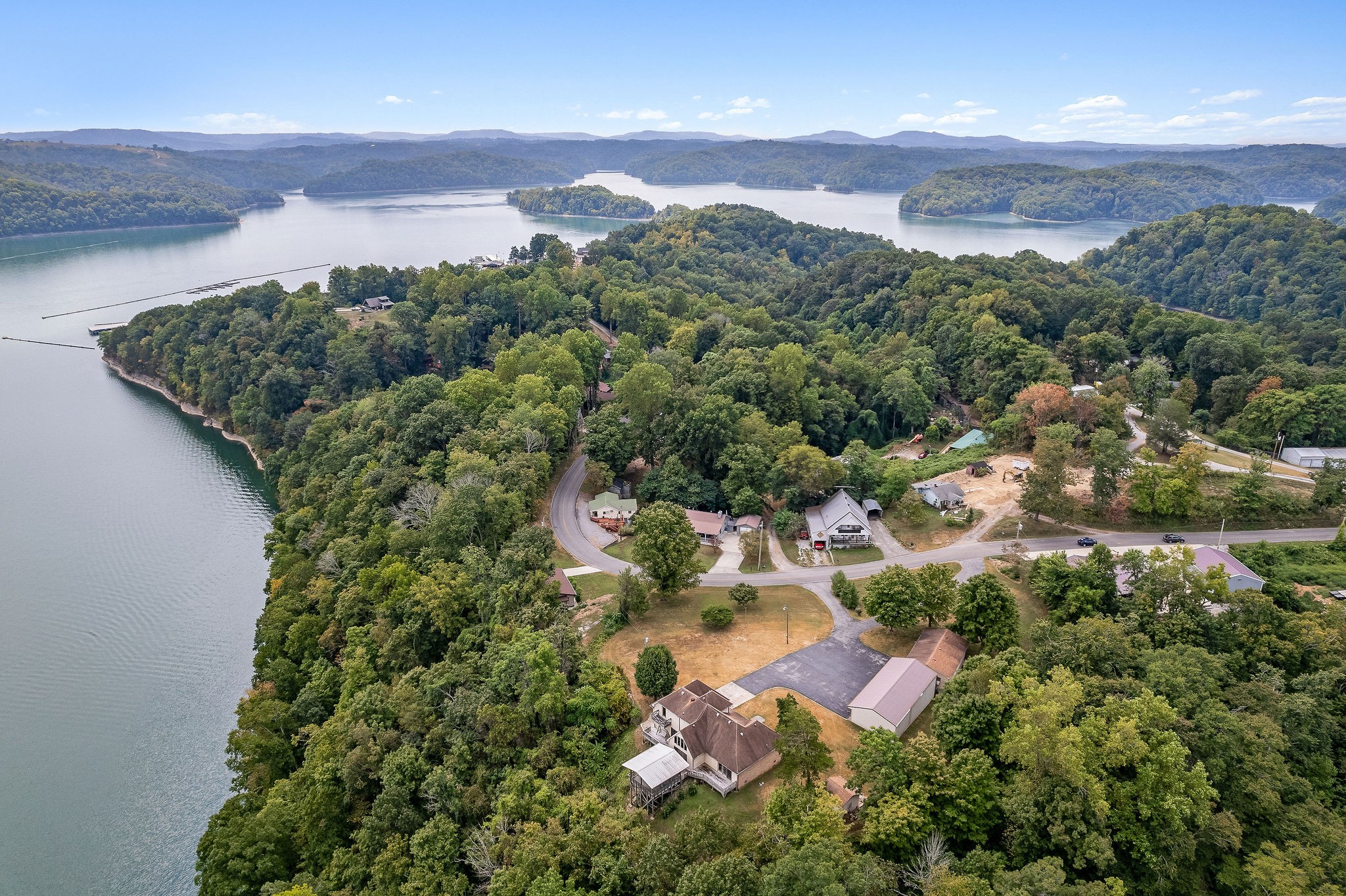 309 Cedar Hill Road Celina, TN 38551 - Photo 53 of 60 an aerial view of residential houses with outdoor space and street view