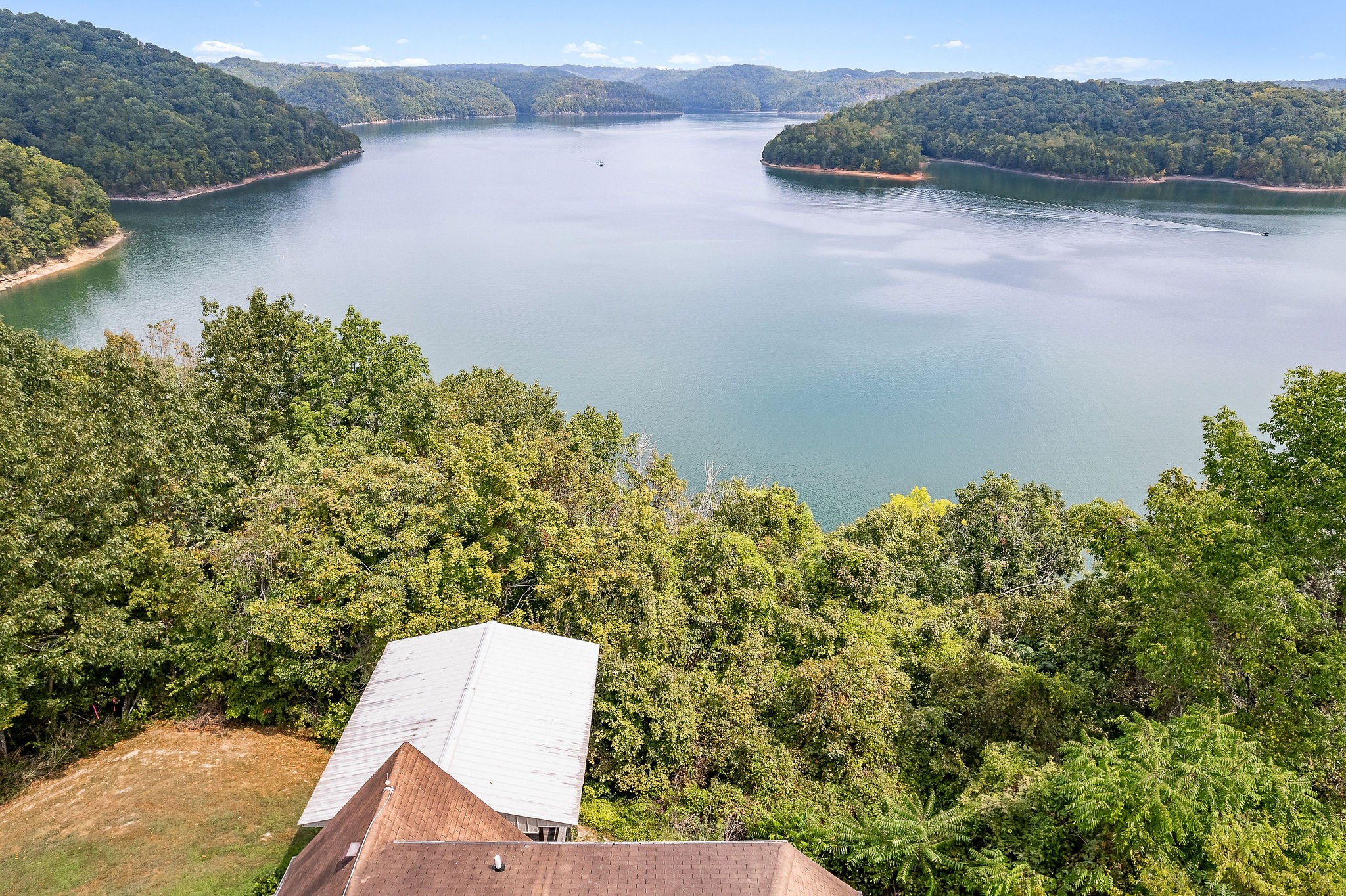 309 Cedar Hill Road Celina, TN 38551 - Photo 56 of 60 an aerial view of a house with a yard and lake view