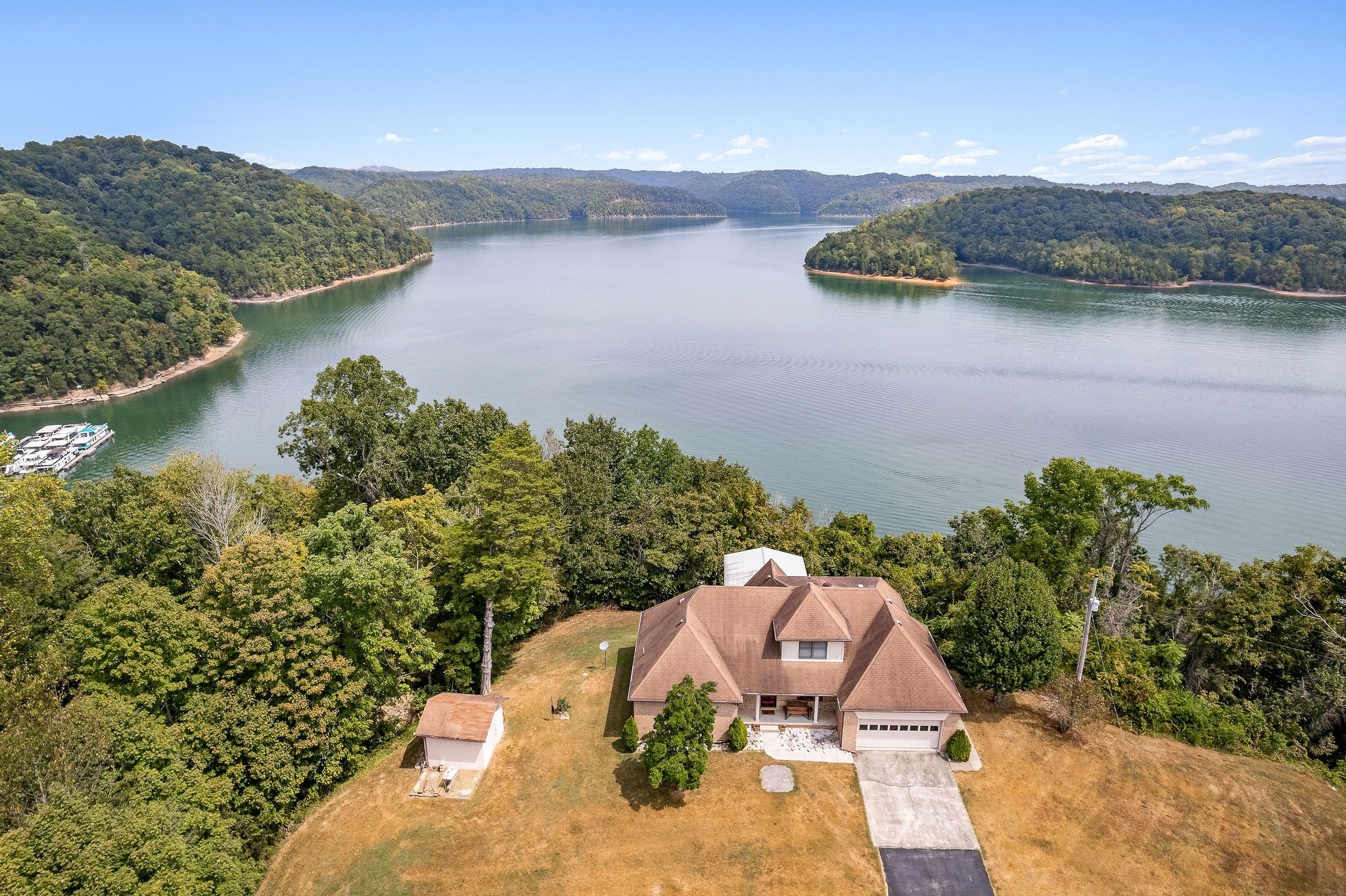 309 Cedar Hill Road Celina, TN 38551 - Photo 57 of 60 an aerial view of a house with a yard and lake view