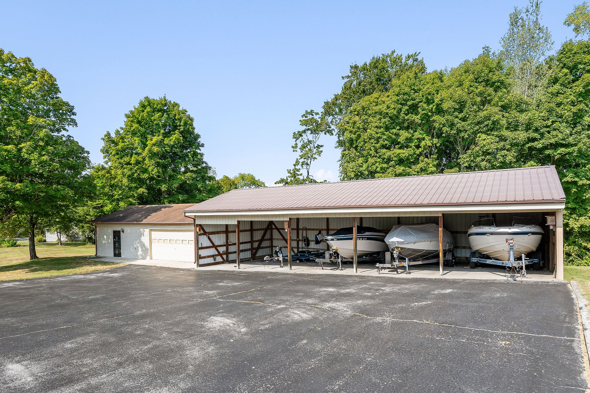 309 Cedar Hill Road Celina, TN 38551 - Photo 6 of 60 a view of a house with a patio and a yard