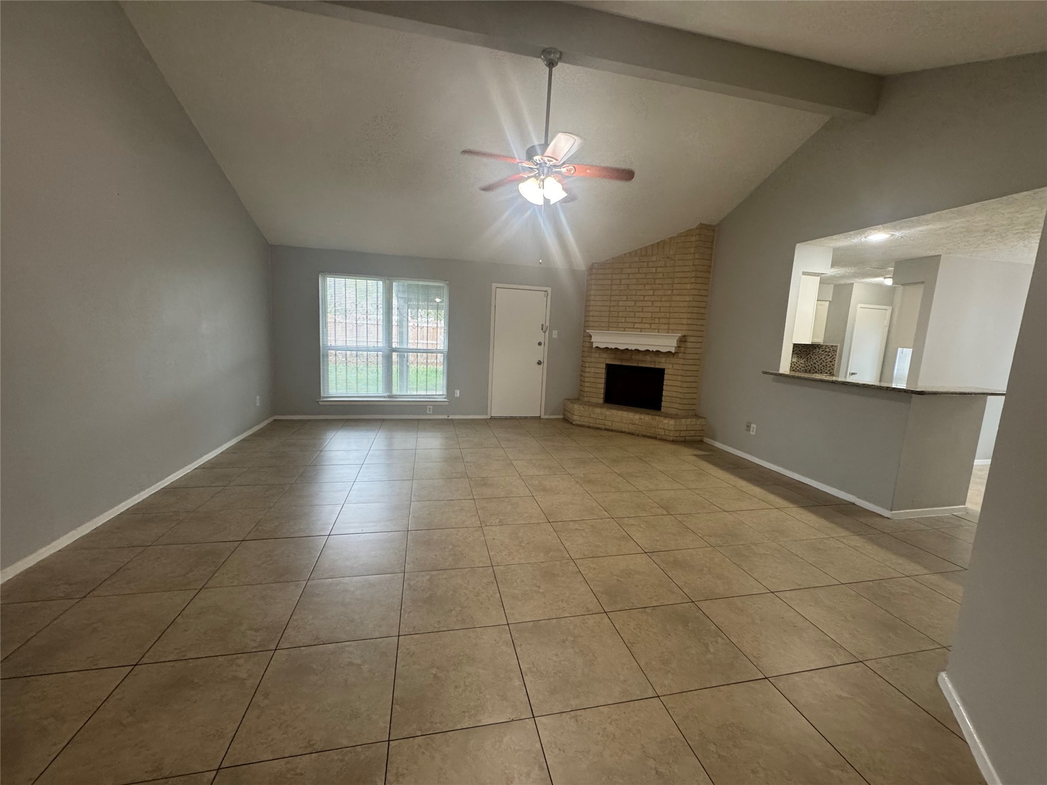 13327 Reads Court Houston, TX 77015 - Photo 2 of 17 a view of an empty room with window and chandelier fan