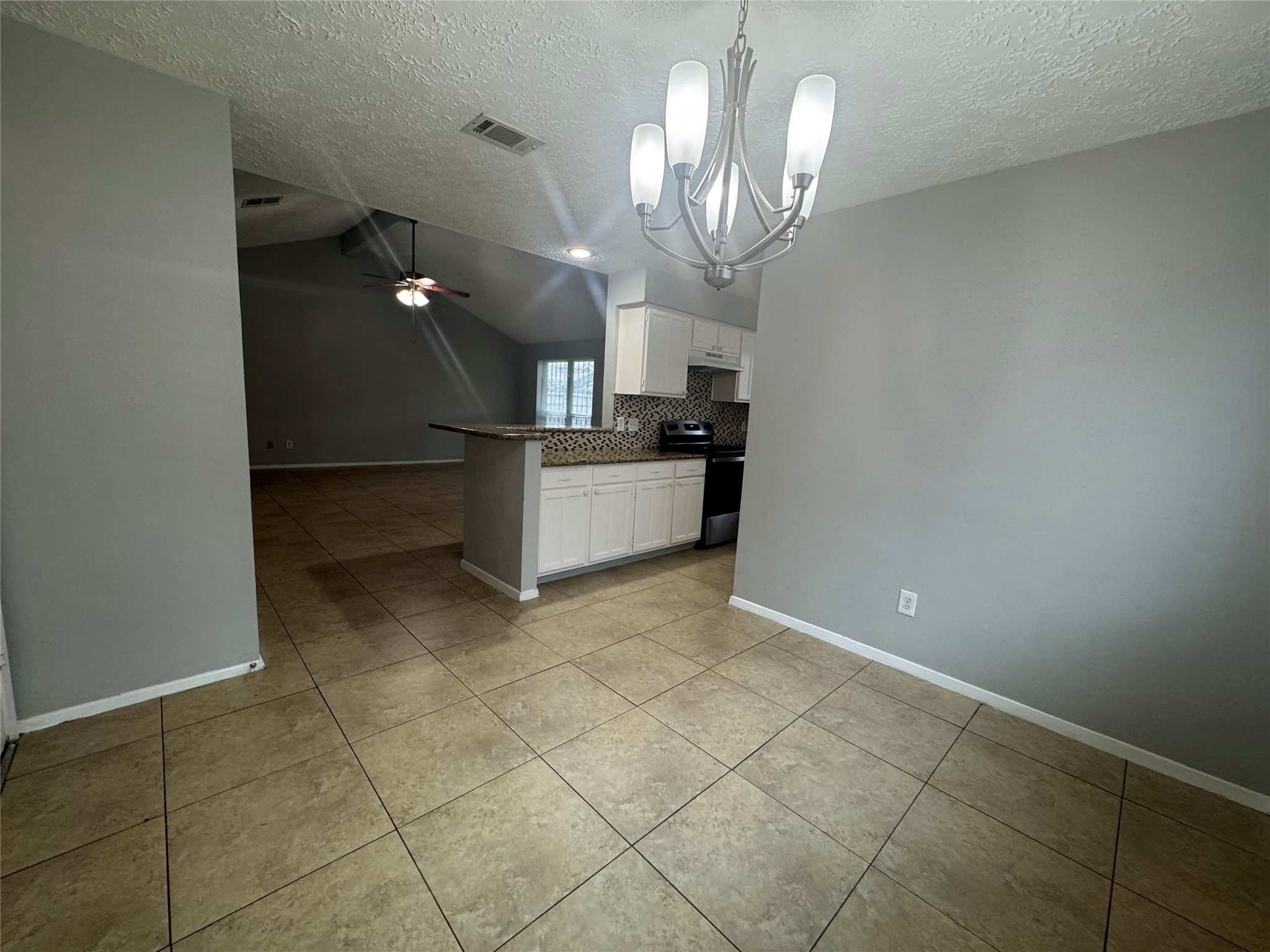 13327 Reads Court Houston, TX 77015 - Photo 4 of 17 a view of a kitchen with a sink and cabinets