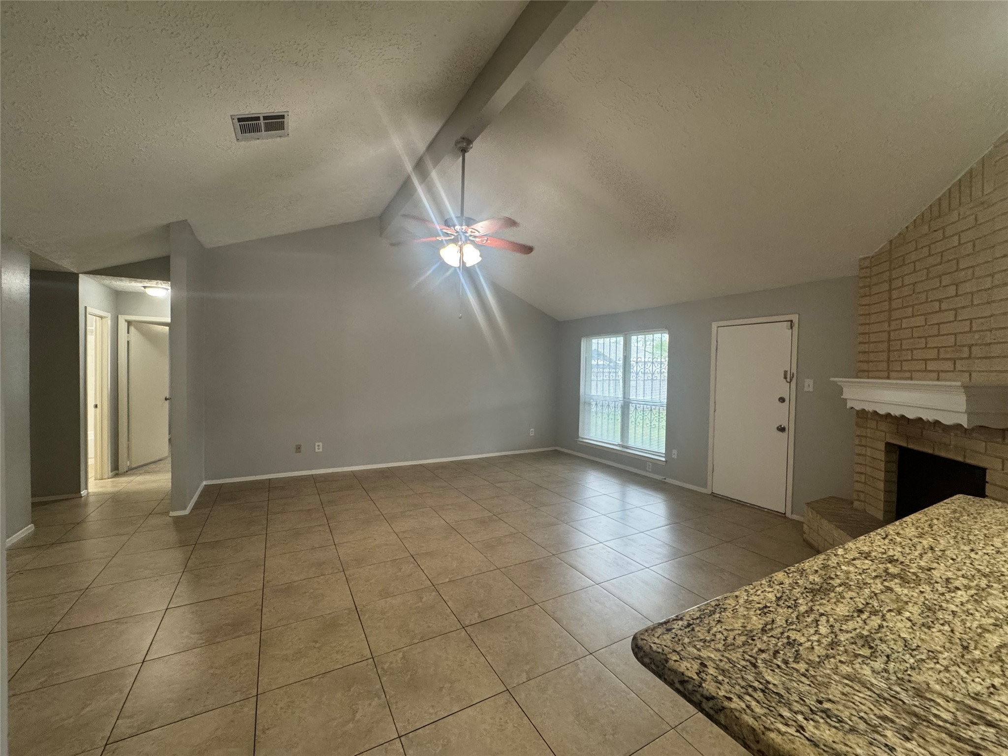 13327 Reads Court Houston, TX 77015 - Photo 8 of 17 a view of an empty room with window and chandelier fan