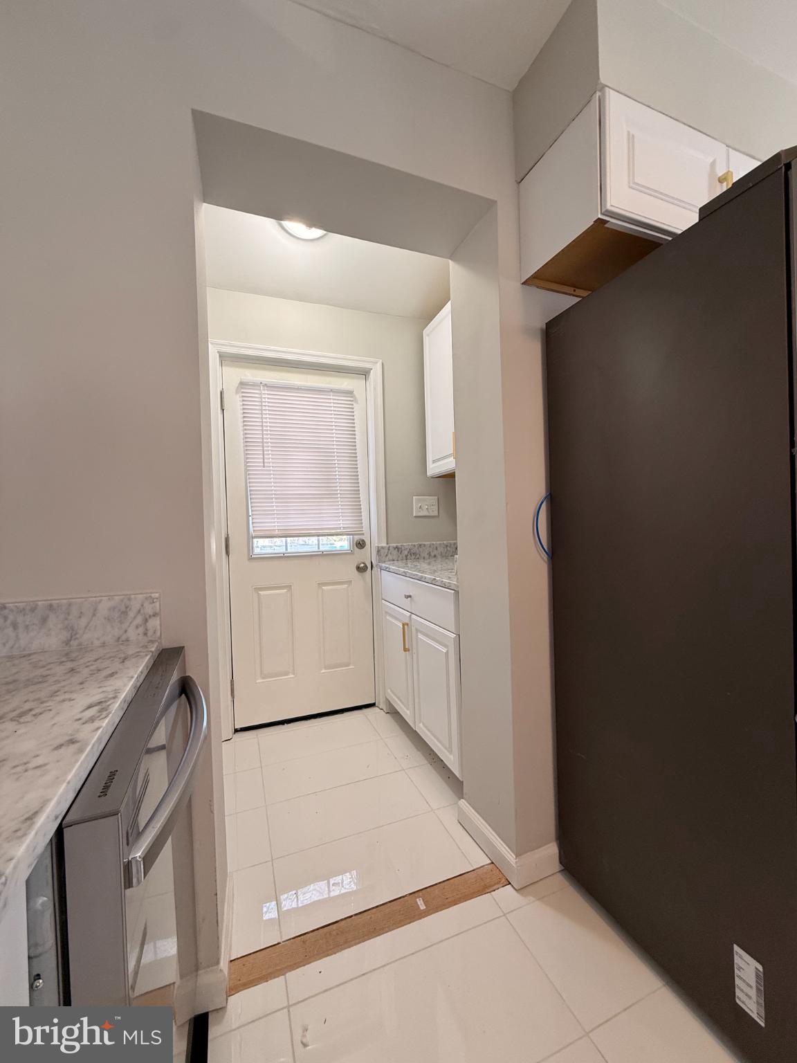 41 Tuckerman Street Northwest Washington, DC 20011 - Photo 13 of 49 a kitchen with a refrigerator and a sink