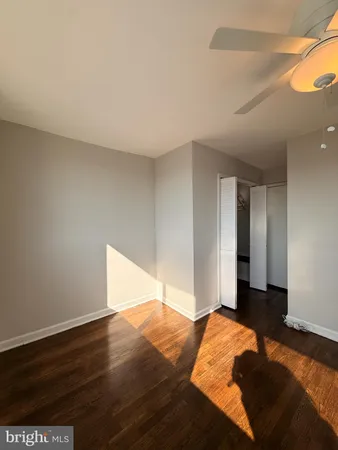 a bedroom with a bed and a potted plant