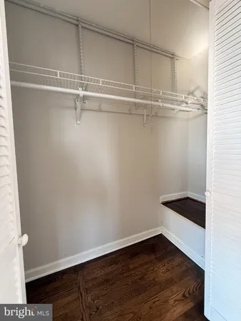 a view of an empty walk in closet