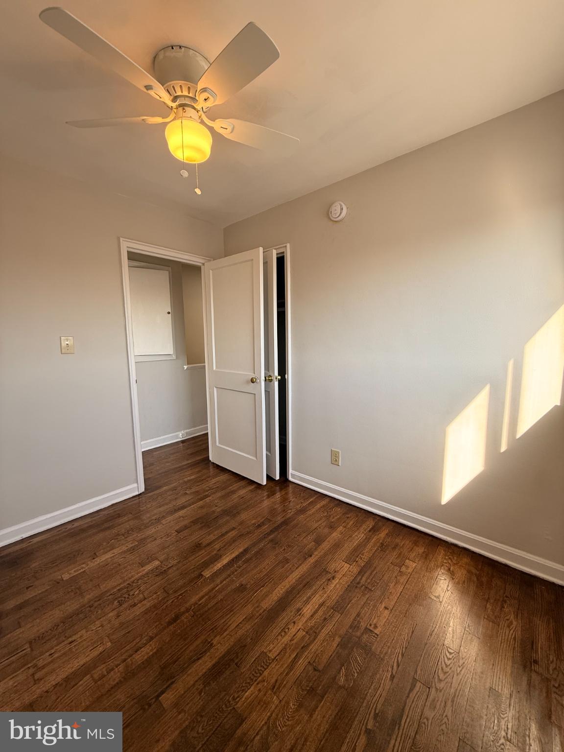 41 Tuckerman Street Northwest Washington, DC 20011 - Photo 32 of 49 an empty room with wooden floor and window