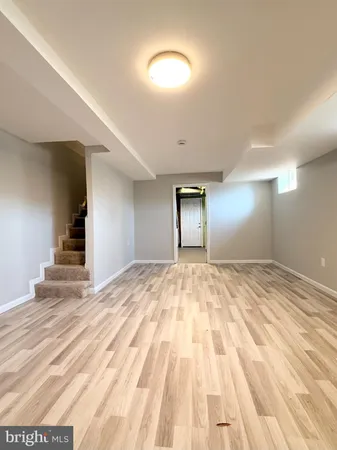 a view of room with wooden floor