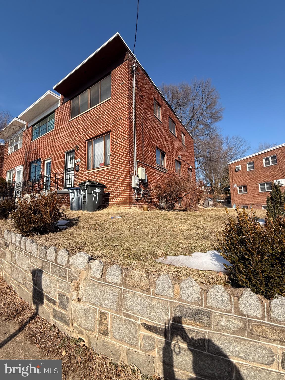 41 Tuckerman Street Northwest Washington, DC 20011 - Photo 48 of 49 a front view of a building with large trees