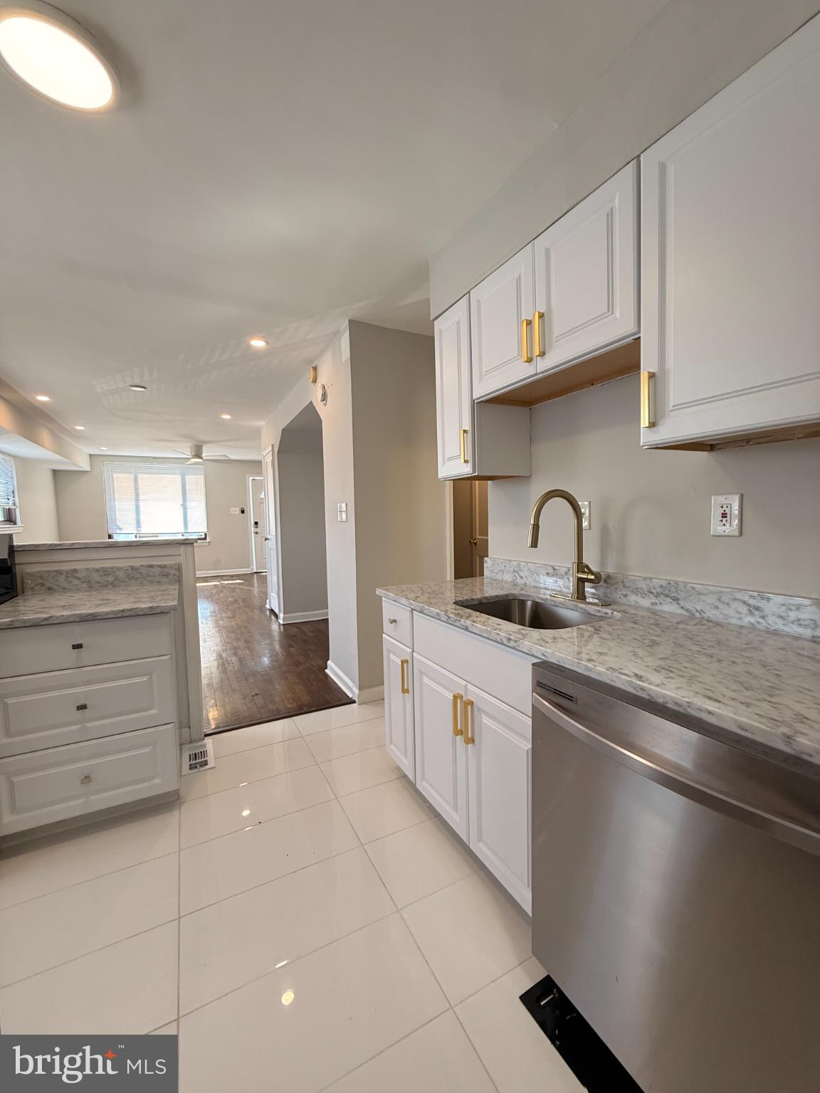 41 Tuckerman Street Northwest Washington, DC 20011 - Photo 8 of 49 a kitchen with stainless steel appliances granite countertop a sink and cabinets