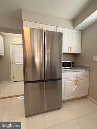 a kitchen with appliances cabinets and a sink
