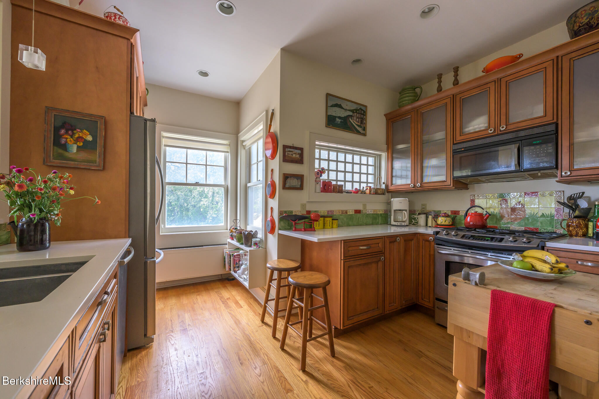 11 Prospect Hill Road, Unit F Stockbridge, MA 01262 - Photo 18 of 51 a kitchen with a refrigerator a sink dishwasher stove and wooden cabinets
