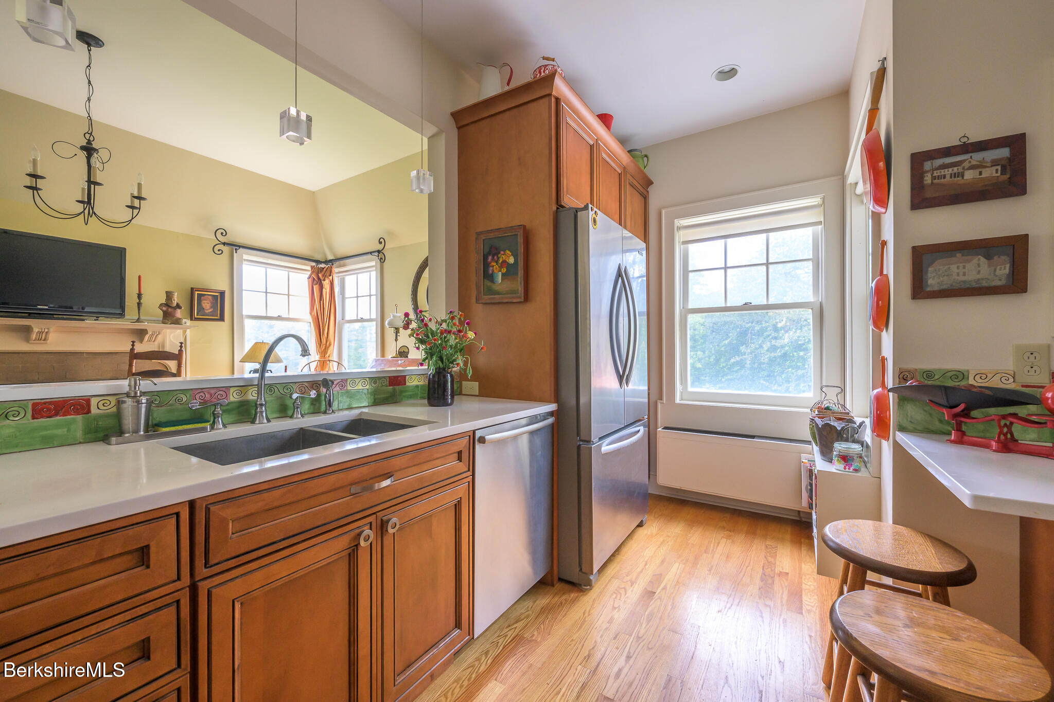 11 Prospect Hill Road, Unit F Stockbridge, MA 01262 - Photo 19 of 51 a kitchen with granite countertop a sink appliances cabinets and wooden floor