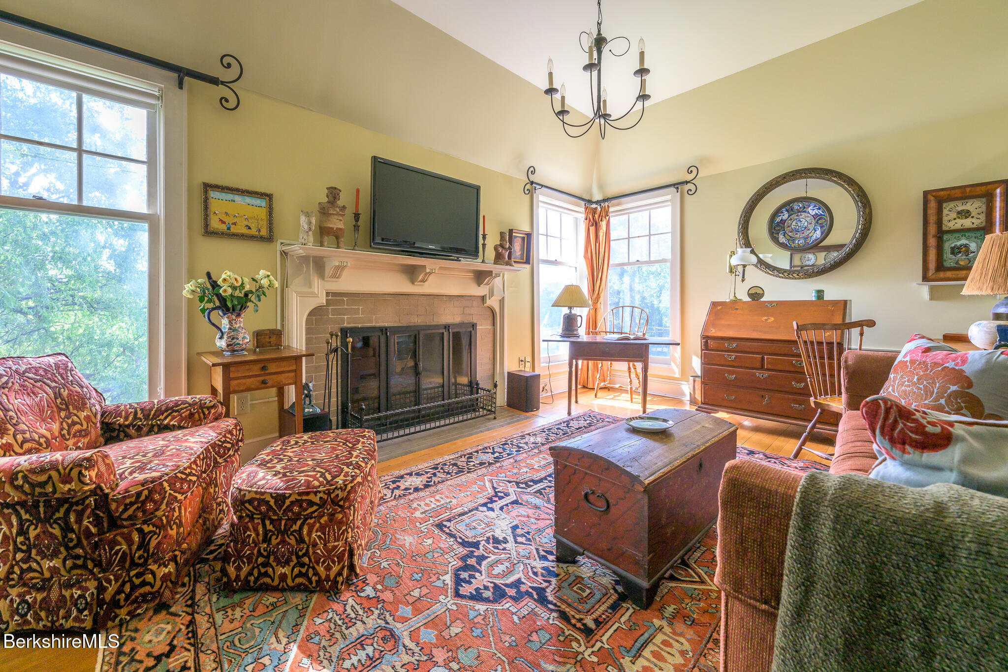 11 Prospect Hill Road, Unit F Stockbridge, MA 01262 - Photo 21 of 51 a living room with fireplace furniture and a flat screen tv