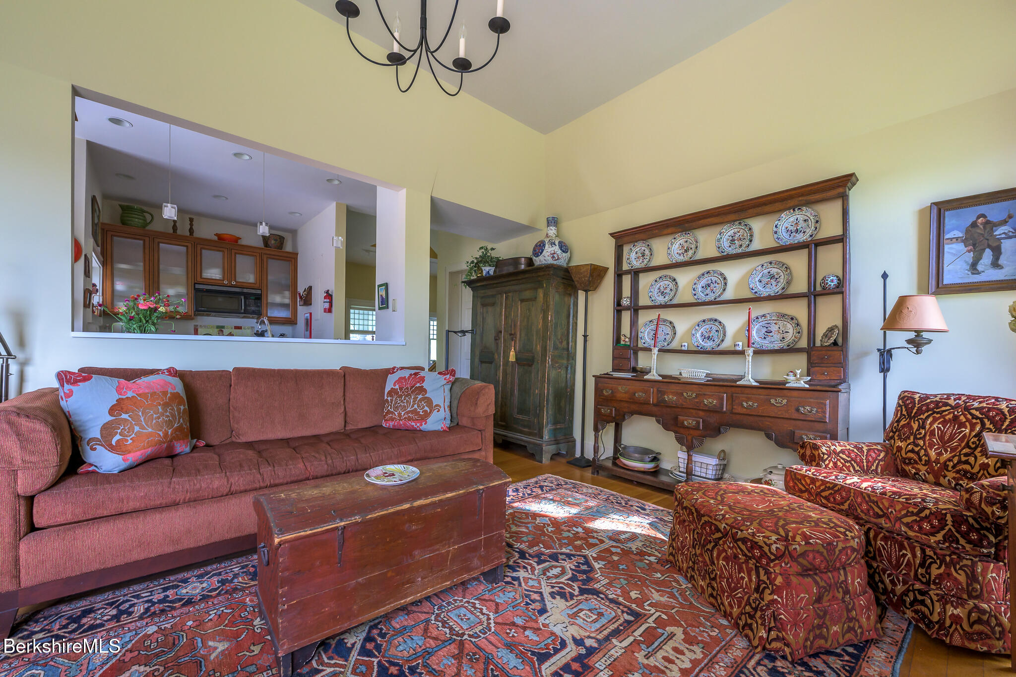 11 Prospect Hill Road, Unit F Stockbridge, MA 01262 - Photo 26 of 51 a living room with furniture and a painting on the wall