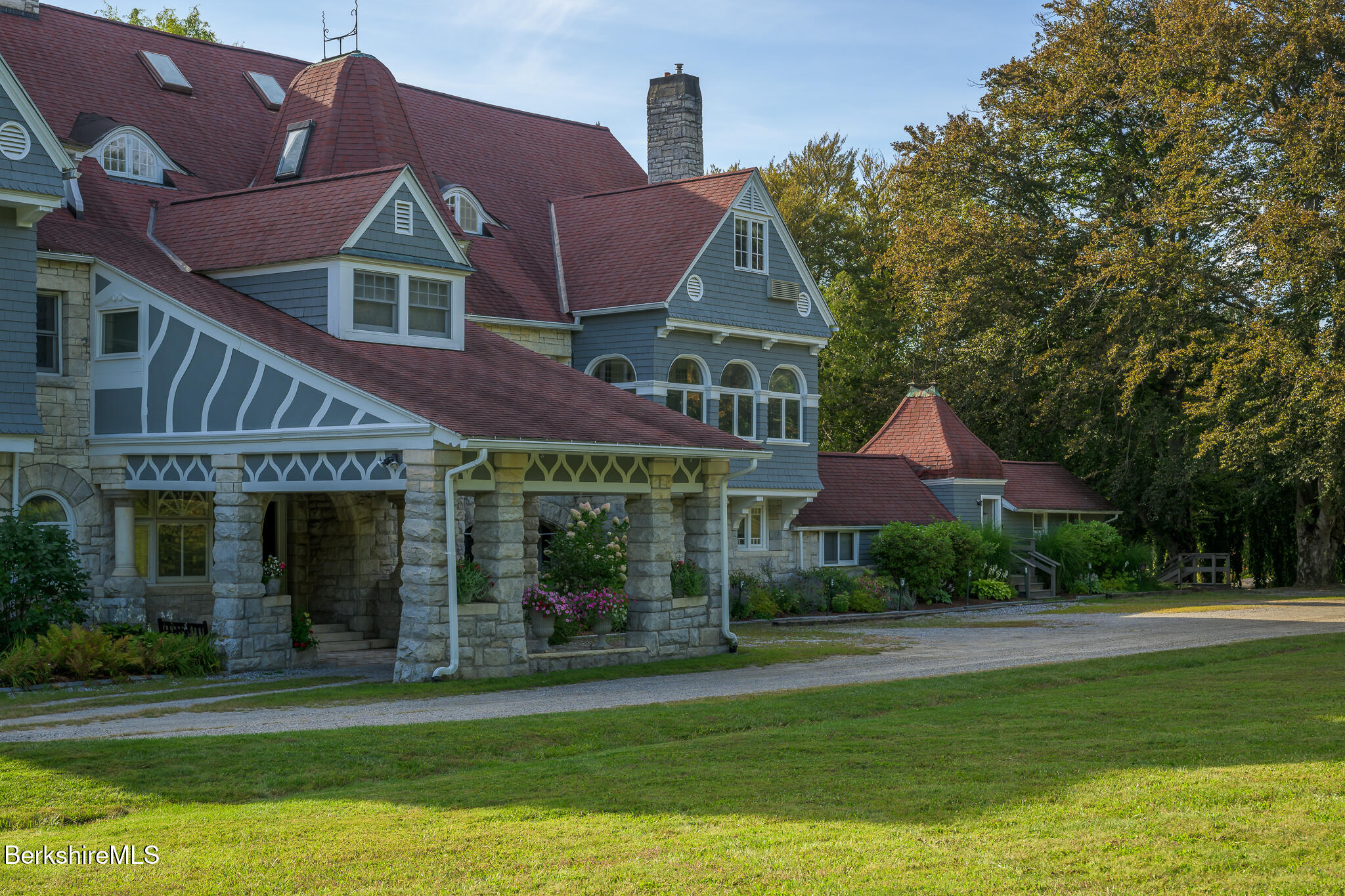 11 Prospect Hill Road, Unit F Stockbridge, MA 01262 - Photo 3 of 51 a front view of a house with a garden