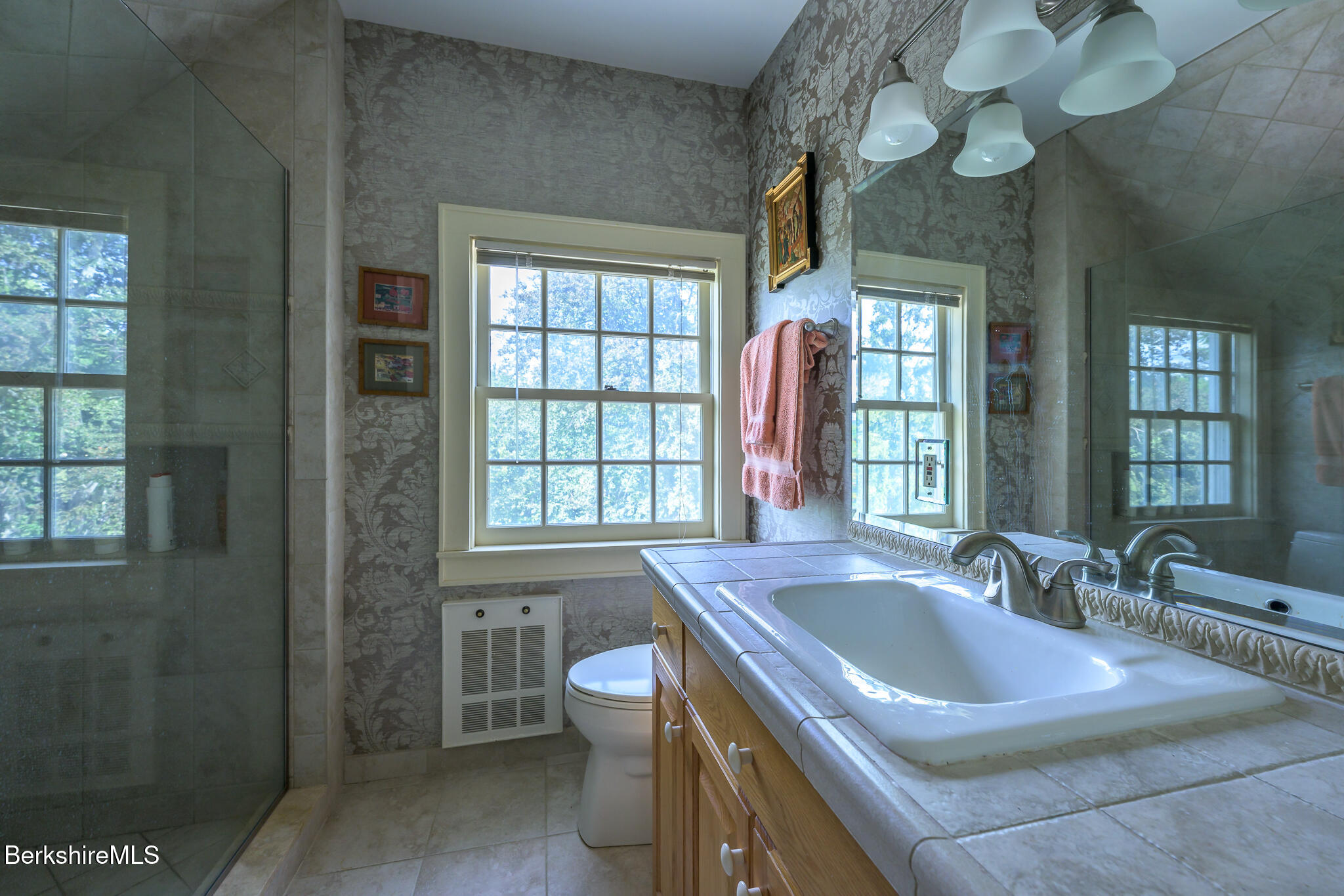 11 Prospect Hill Road, Unit F Stockbridge, MA 01262 - Photo 39 of 51 a bathroom with a sink a large mirror and a bathtub