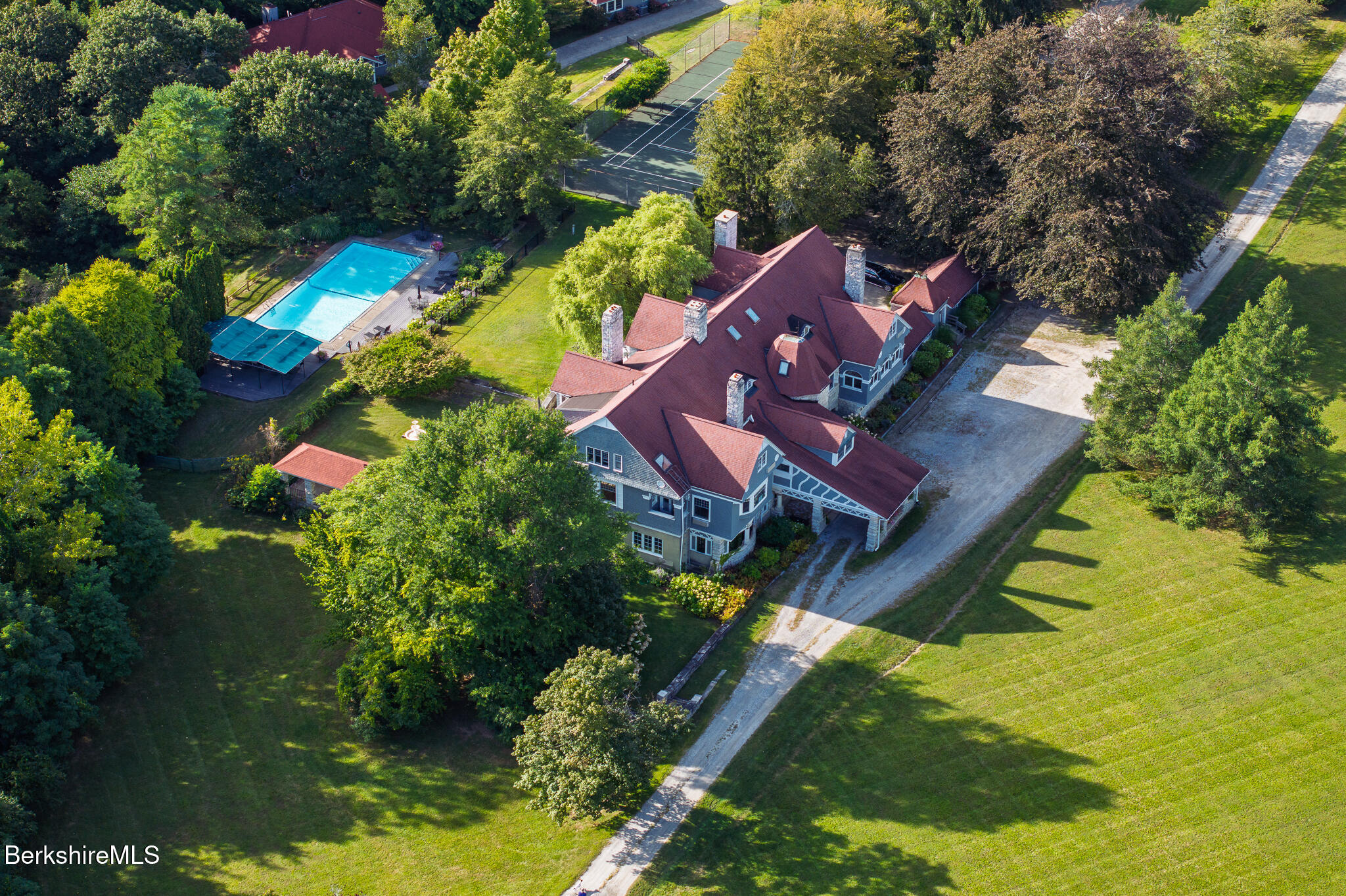 11 Prospect Hill Road, Unit F Stockbridge, MA 01262 - Photo 41 of 51 an aerial view of a house with a yard basket ball court and outdoor seating