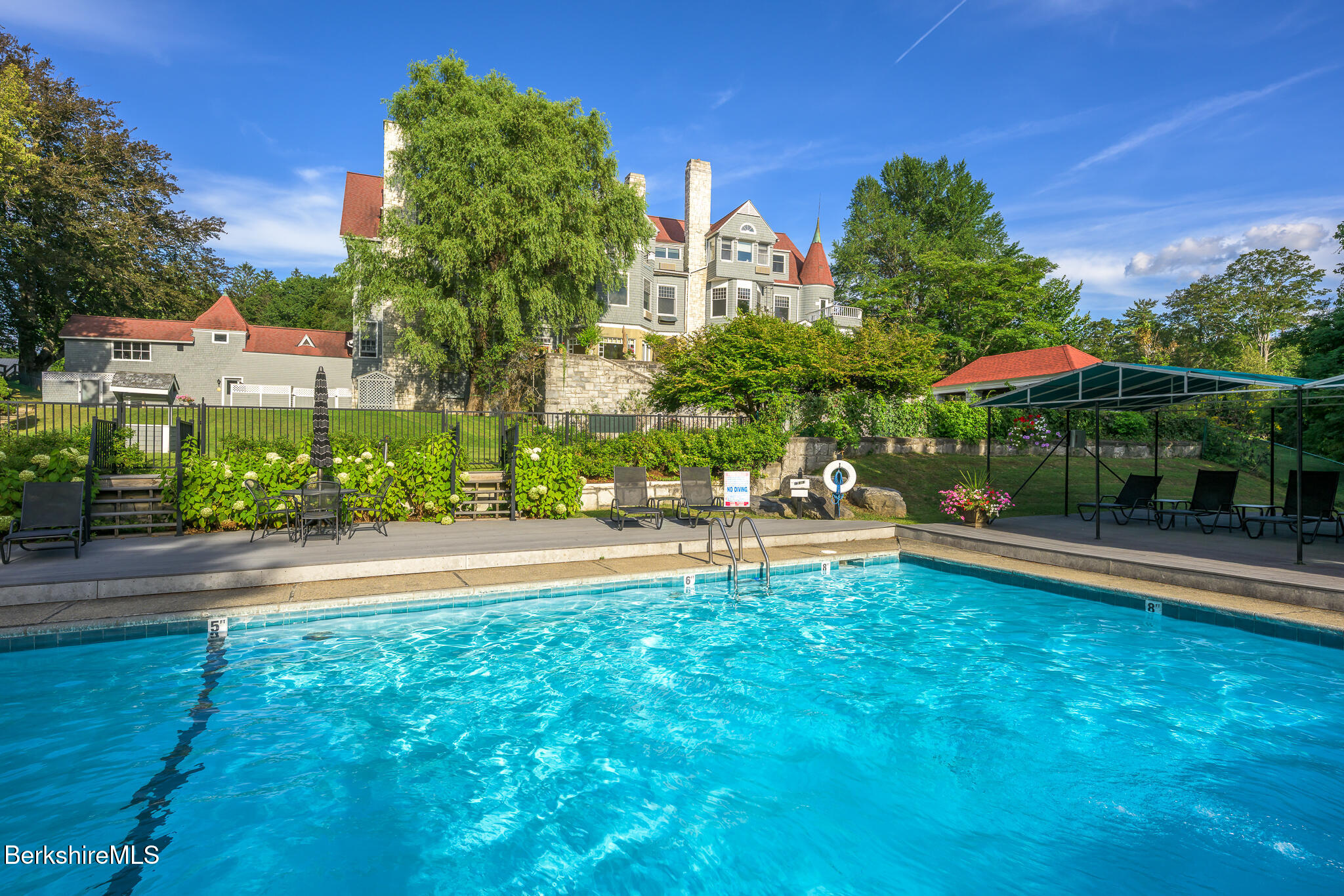 11 Prospect Hill Road, Unit F Stockbridge, MA 01262 - Photo 43 of 51 a view of a swimming pool with a patio and a yard