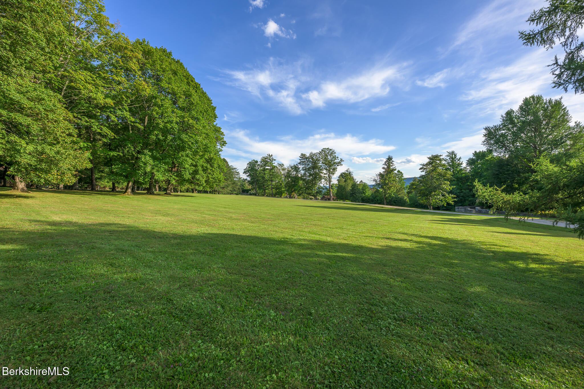 11 Prospect Hill Road, Unit F Stockbridge, MA 01262 - Photo 46 of 51 a view of a green field with wooden fence