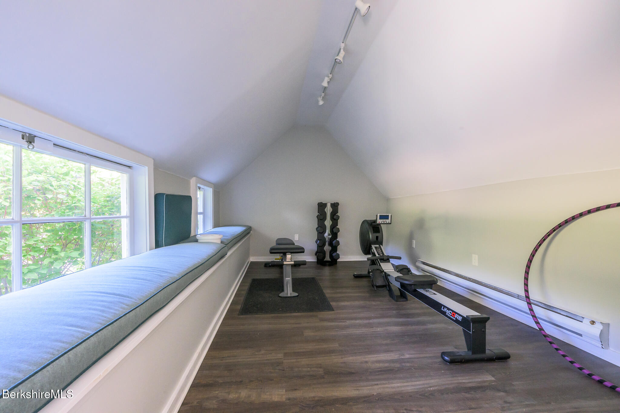 11 Prospect Hill Road, Unit F Stockbridge, MA 01262 - Photo 49 of 51 a room with gym equipment and wooden floor