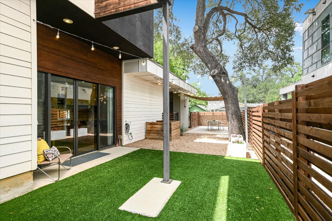 Turf and River Pebble Low-Maintenance Backyard