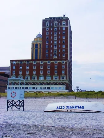 a view of a tall building with a swimming pool