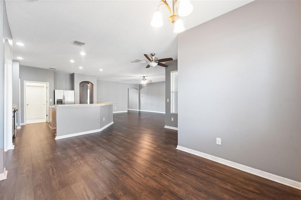 14027 Bensbrook Drive Spring Hill, FL 34609 - Photo 11 of 61 a view of a kitchen with wooden floor and a sink
