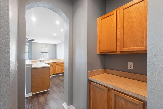 a kitchen that has a sink a stove and a table in it