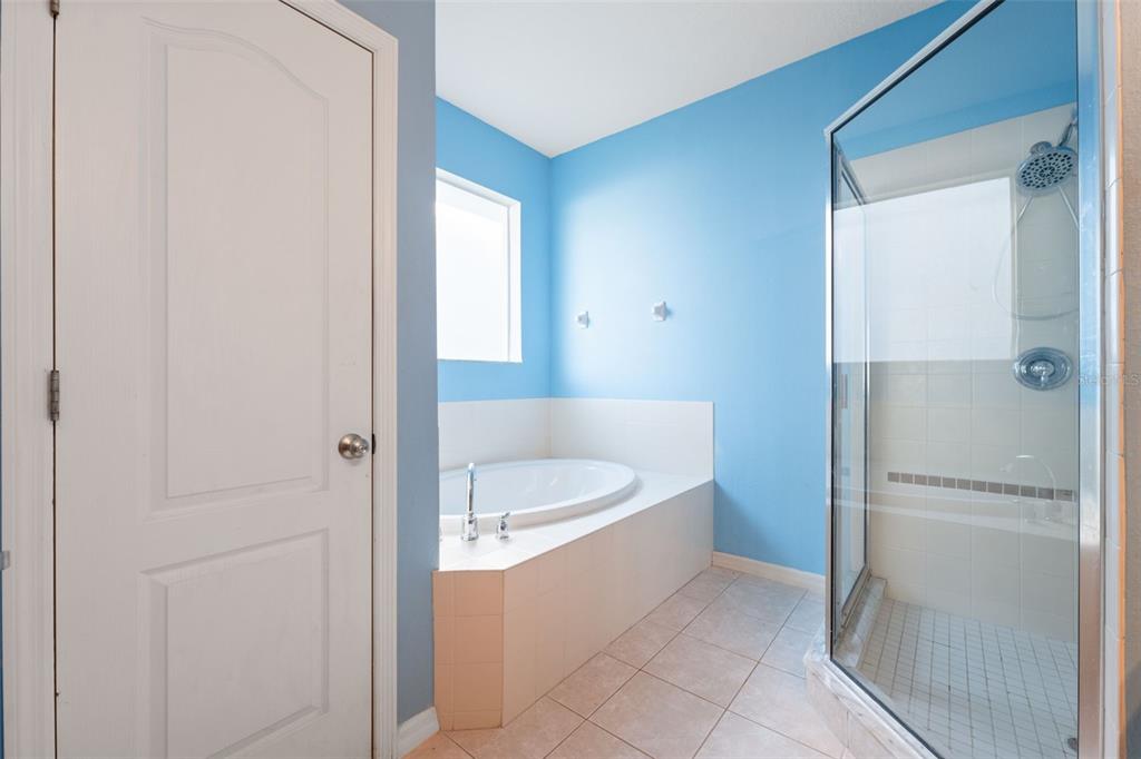 14027 Bensbrook Drive Spring Hill, FL 34609 - Photo 26 of 61 a bathroom with a tub sink and shower