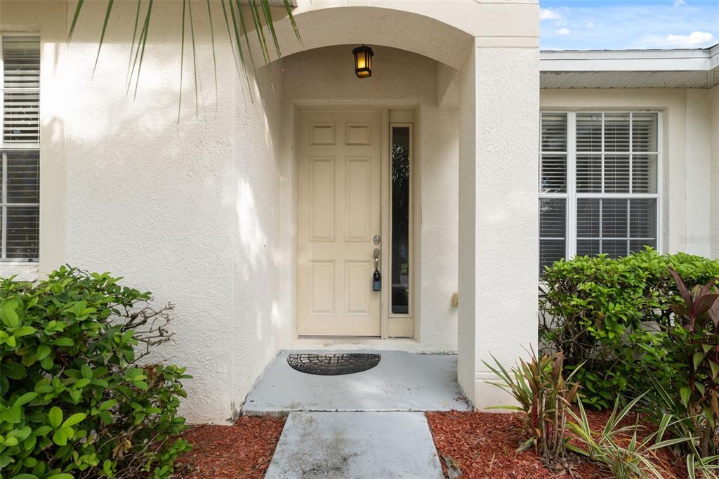 14027 Bensbrook Drive Spring Hill, FL 34609 - Photo 3 of 61 a front view of a house with a garden