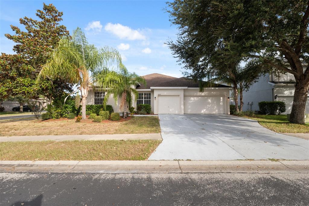 14027 Bensbrook Drive Spring Hill, FL 34609 - Photo 60 of 61 front view of a house with a yard