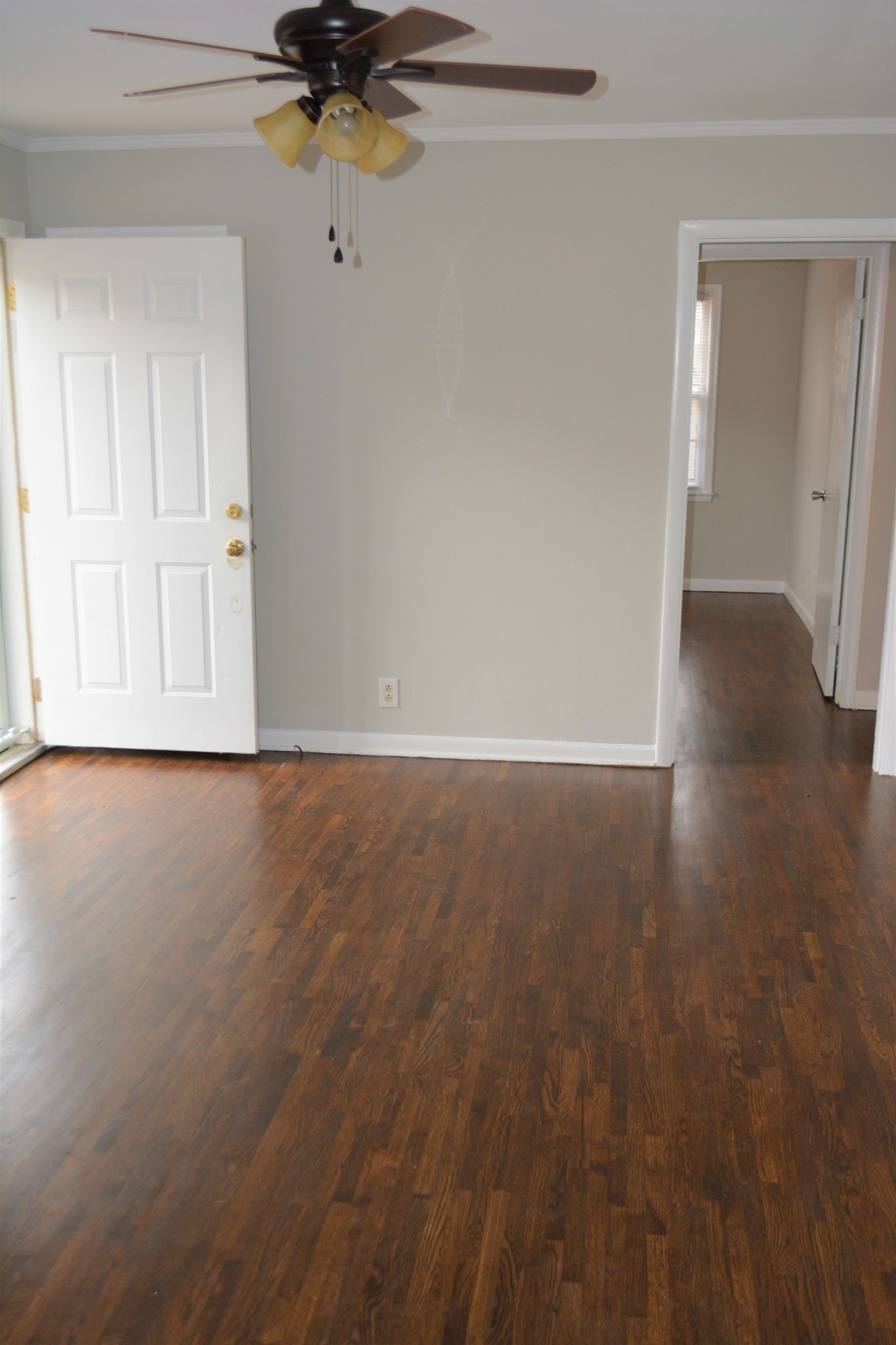 111 Chestnut Street Smyrna, TN 37167 - Photo 3 of 13 an empty room with wooden floor fan and windows