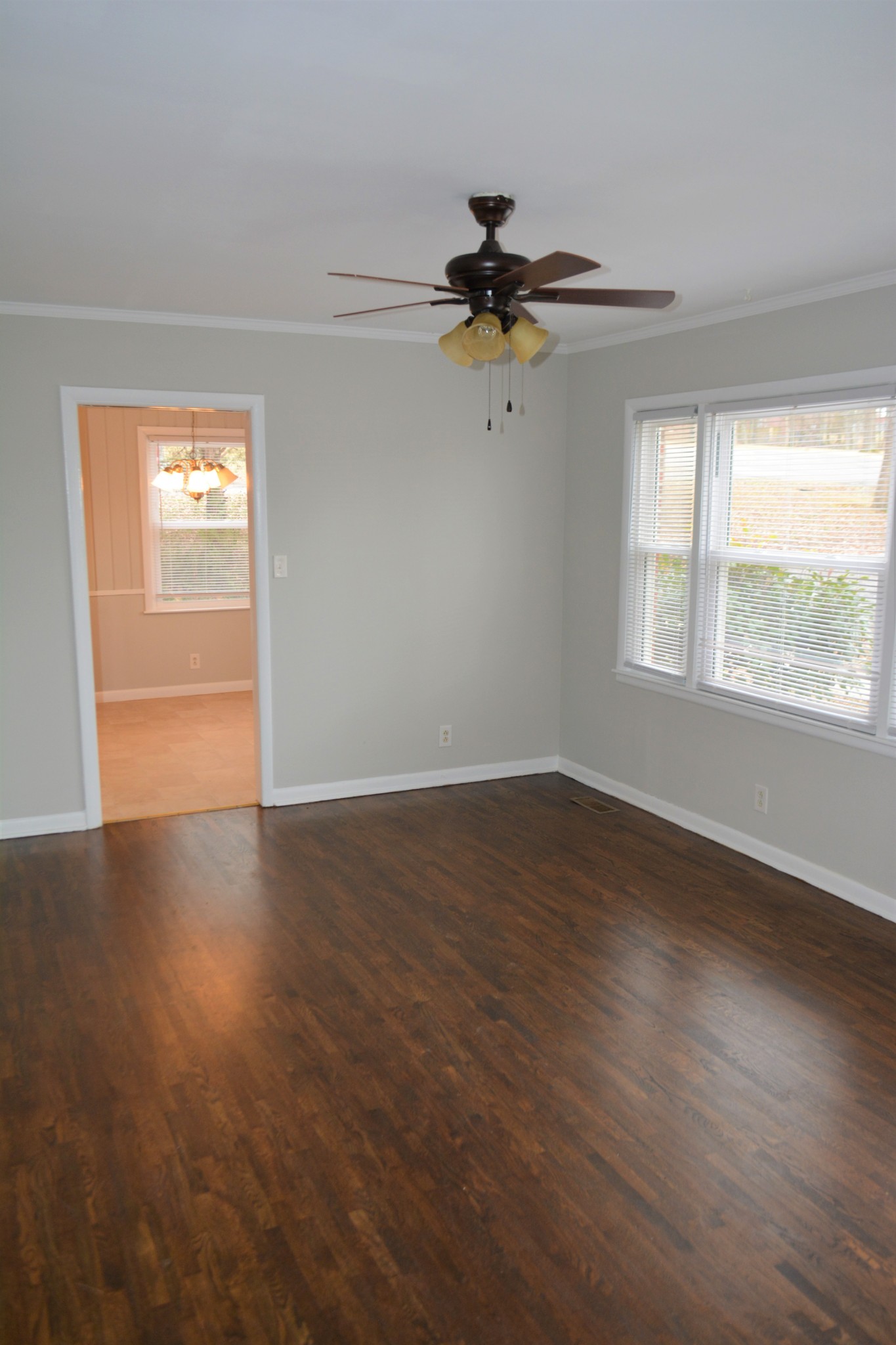 111 Chestnut Street Smyrna, TN 37167 - Photo 4 of 13 a view of an empty room with wooden floor and a window