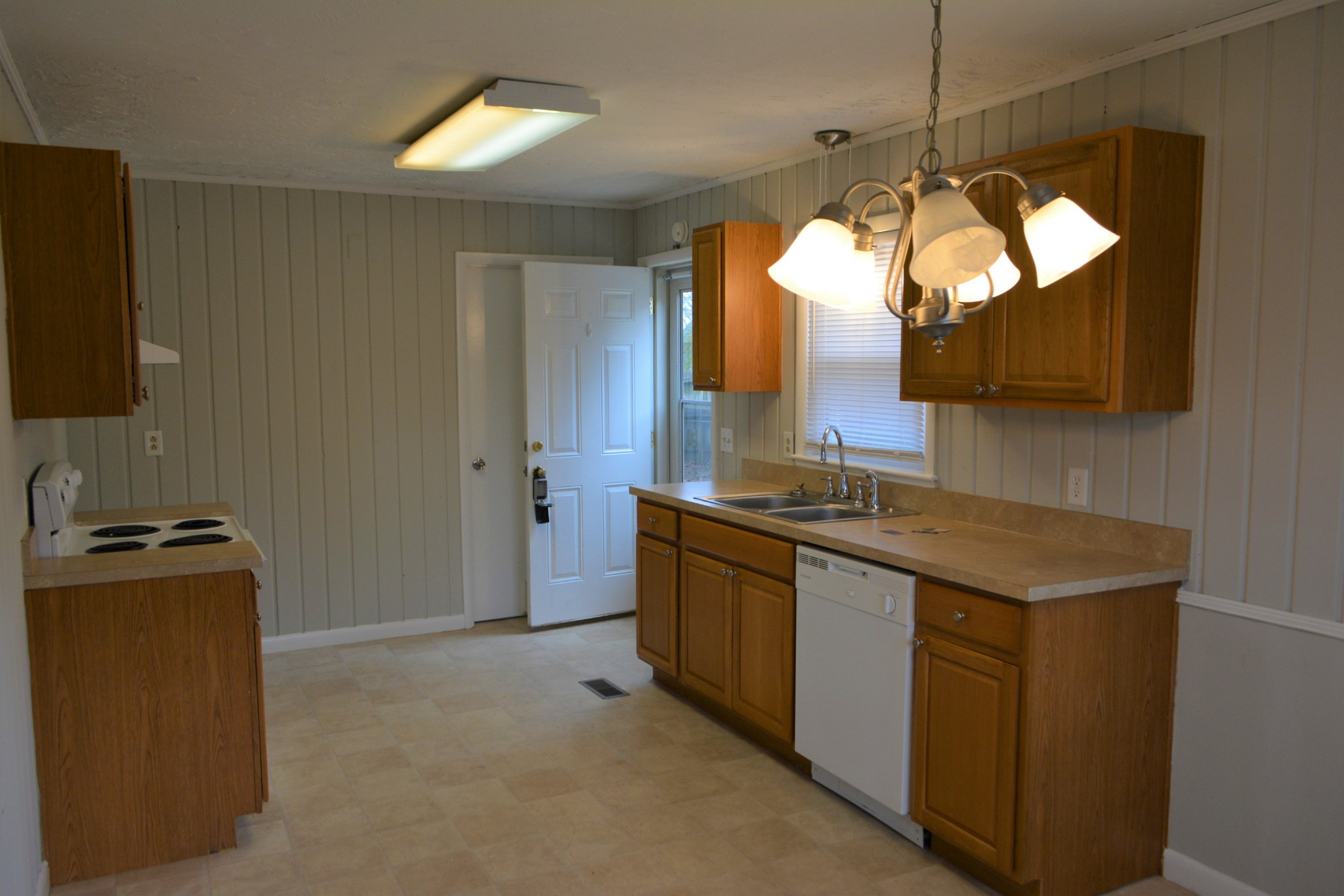 111 Chestnut Street Smyrna, TN 37167 - Photo 5 of 13 a kitchen with stainless steel appliances granite countertop sink stove and refrigerator