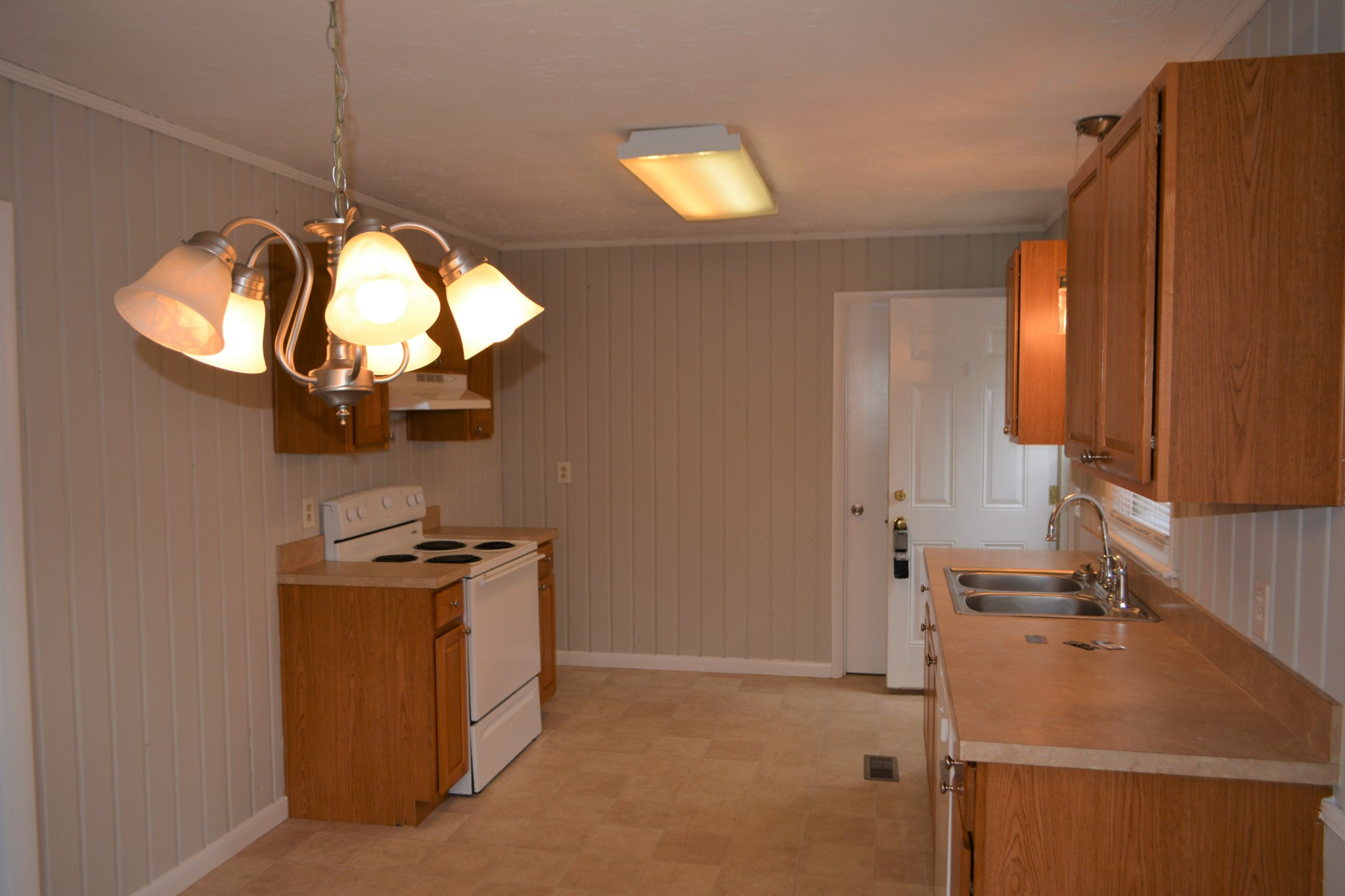 111 Chestnut Street Smyrna, TN 37167 - Photo 6 of 13 a room with a stove a mirror and cabinets