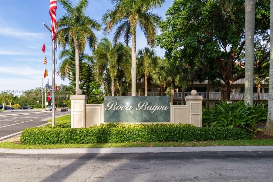 14 Royal Palm Way, Unit 5010 Boca Raton, FL 33432 - Photo 1 of 15 a front view of multi story residential apartment building with yard and sign board