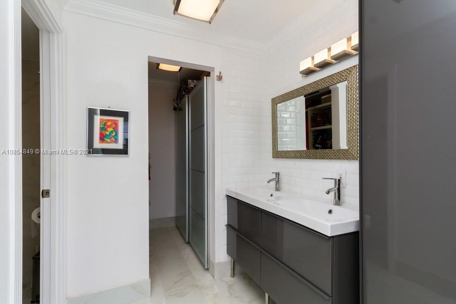 14 Royal Palm Way, Unit 5010 Boca Raton, FL 33432 - Photo 11 of 15 a bathroom with a sink and a mirror