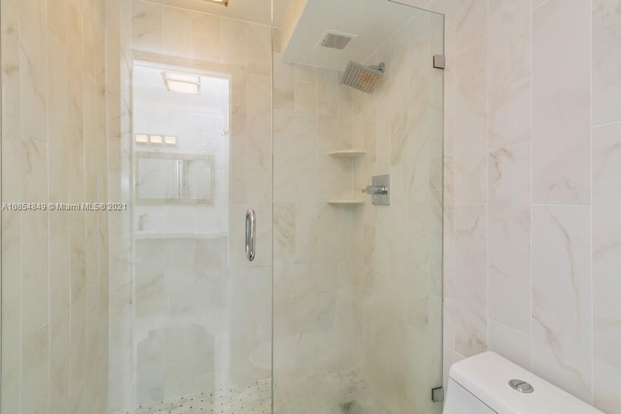 14 Royal Palm Way, Unit 5010 Boca Raton, FL 33432 - Photo 12 of 15 a bathroom with a shower and toilet