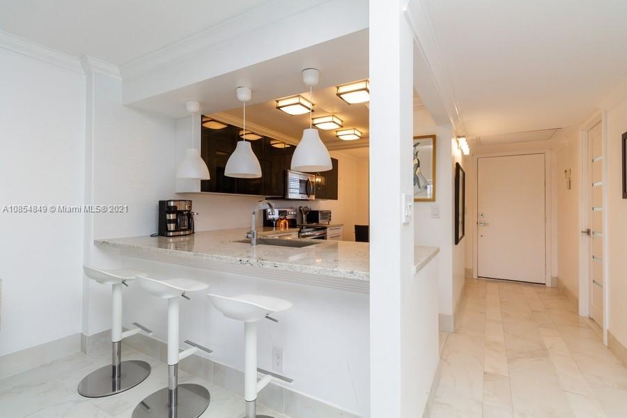 14 Royal Palm Way, Unit 5010 Boca Raton, FL 33432 - Photo 5 of 15 a view of kitchen island with furniture and kitchen view