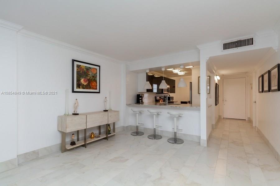 14 Royal Palm Way, Unit 5010 Boca Raton, FL 33432 - Photo 6 of 15 a living room with furniture and a table
