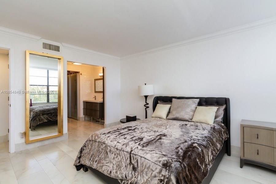 14 Royal Palm Way, Unit 5010 Boca Raton, FL 33432 - Photo 10 of 15 a bedroom with a large bed and a closet