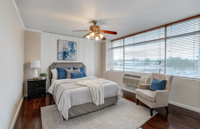 a bedroom with a bed and a couch